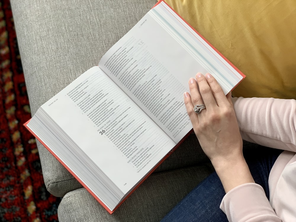 person holding white printer paper