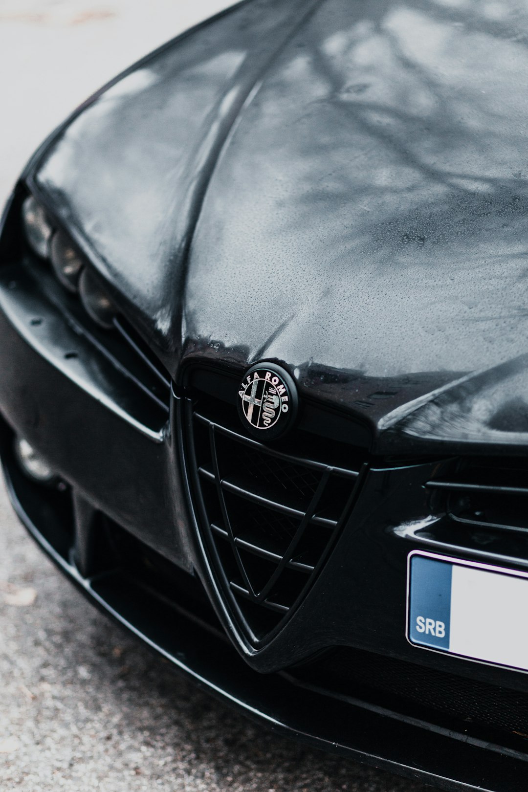 black mercedes benz car with blue car hood