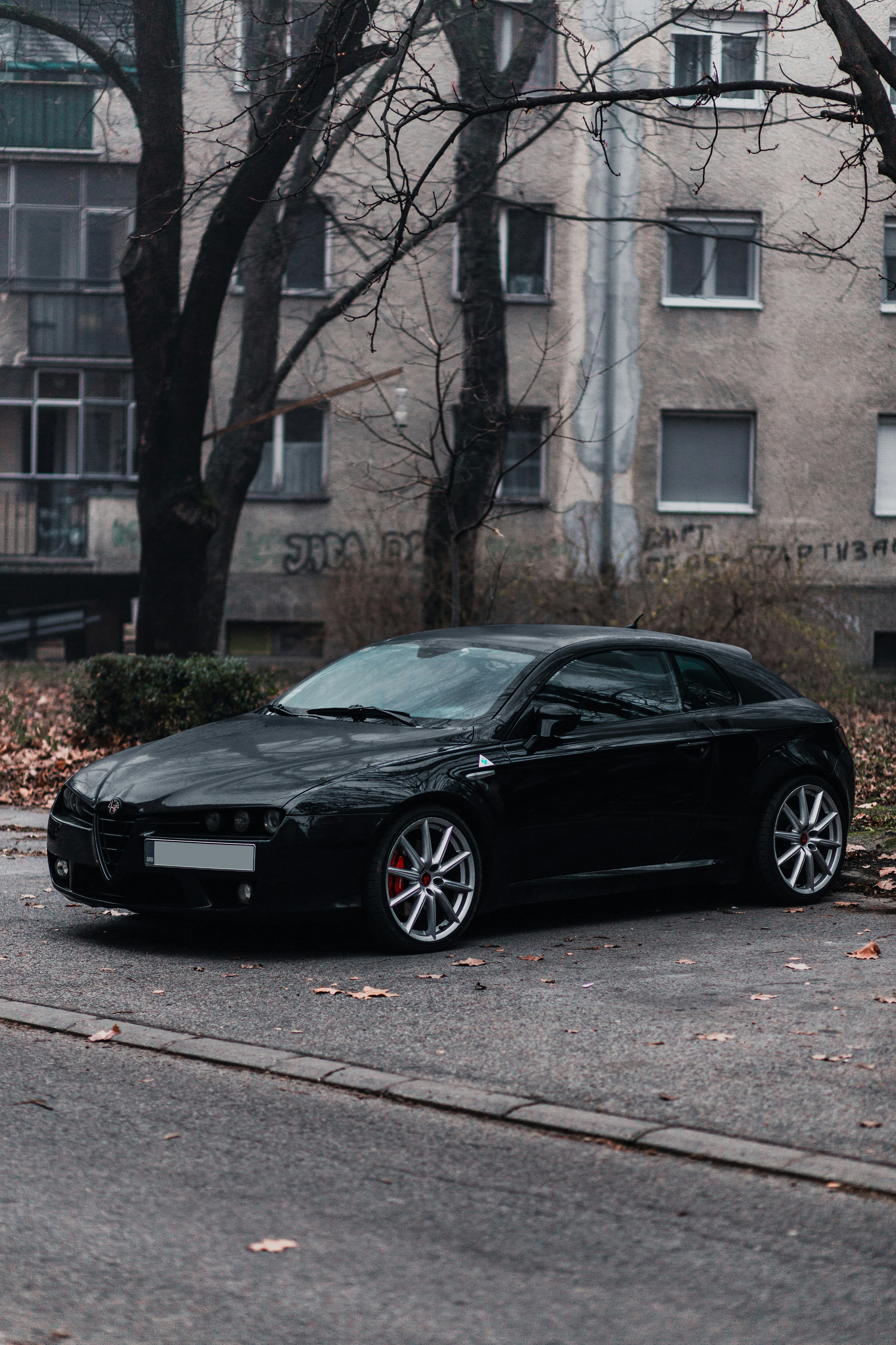 black porsche 911 parked on road during daytime