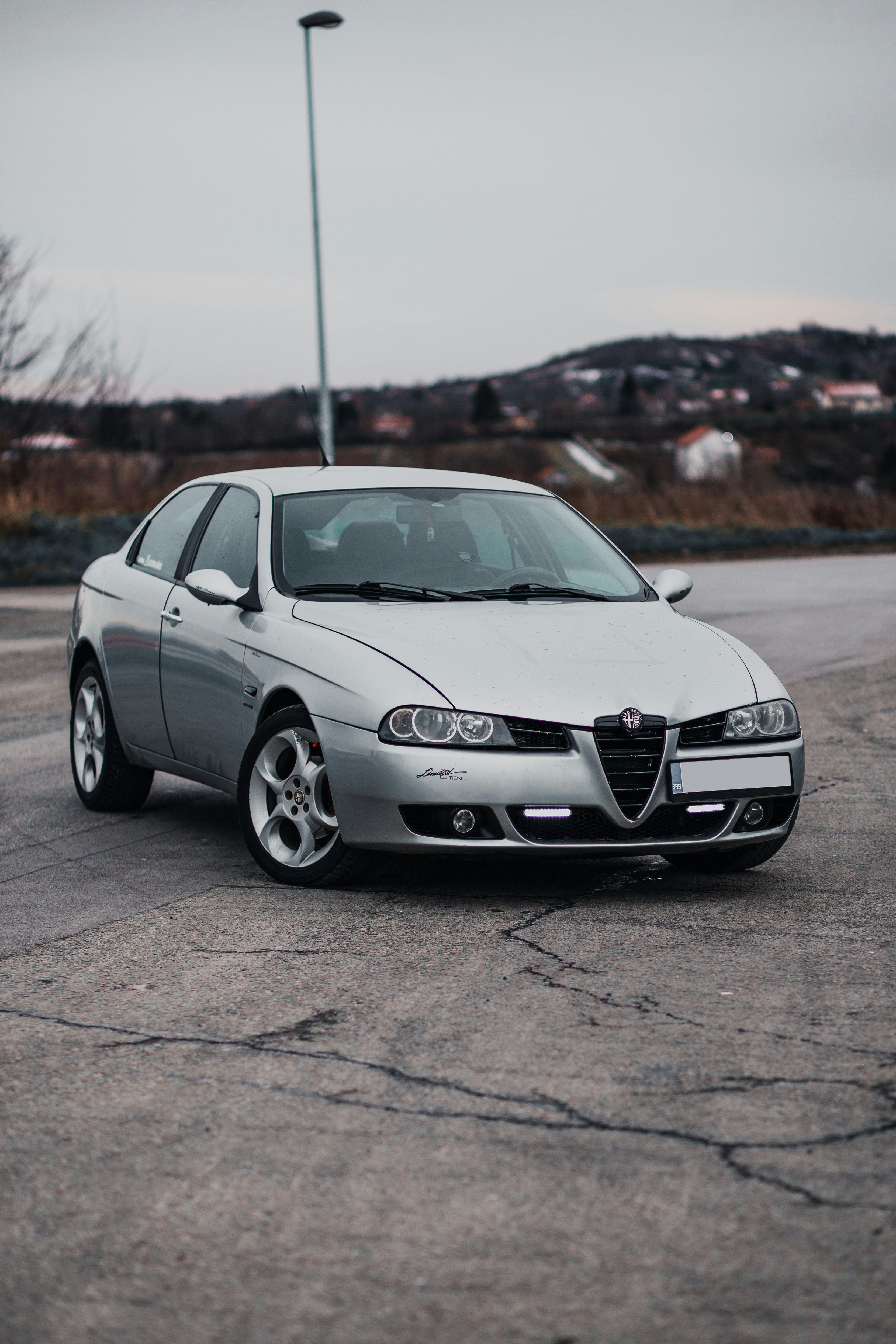 white mercedes benz coupe on gray asphalt road during daytime
