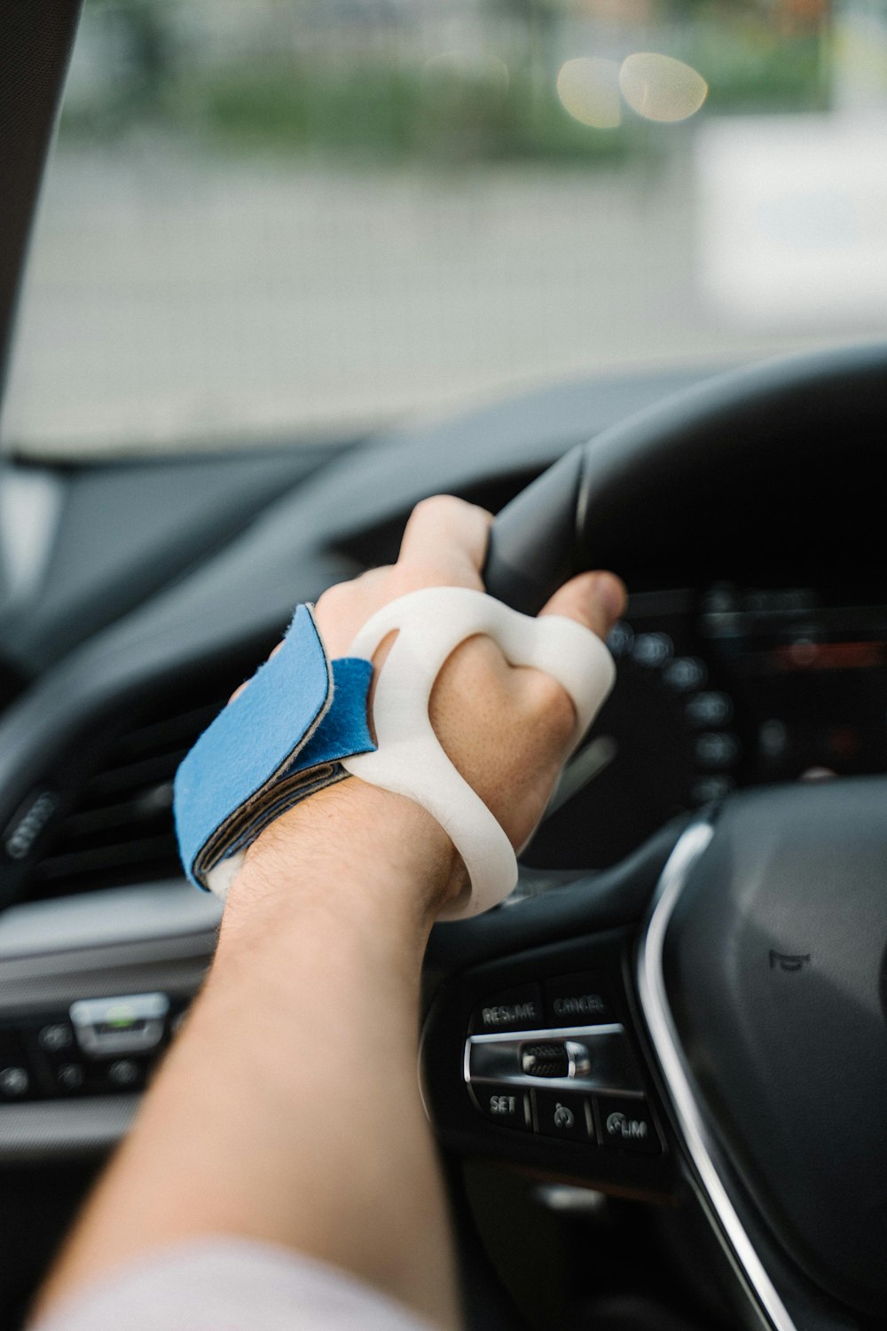 person wearing blue and white gloves