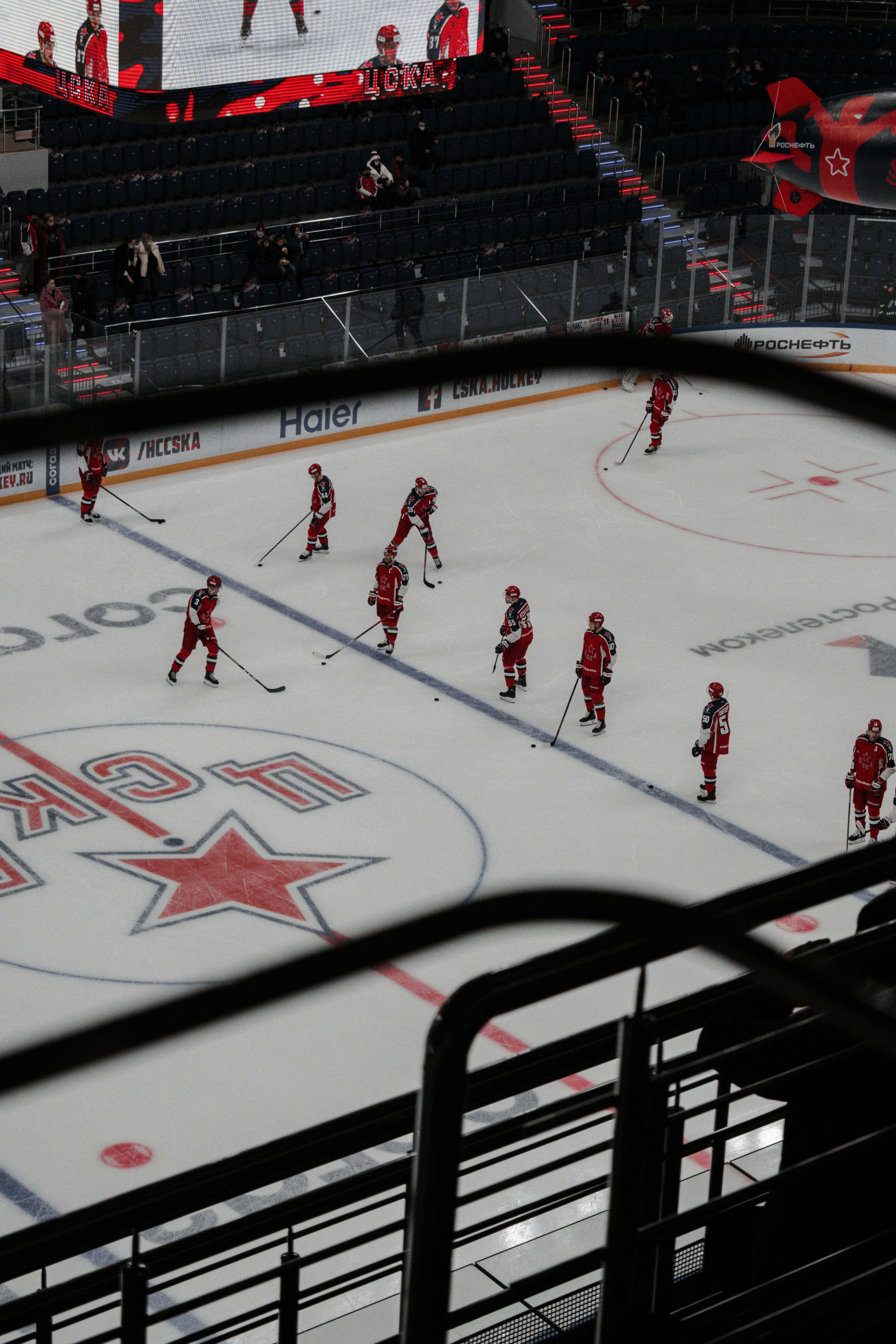 people playing ice hockey on ice stadium