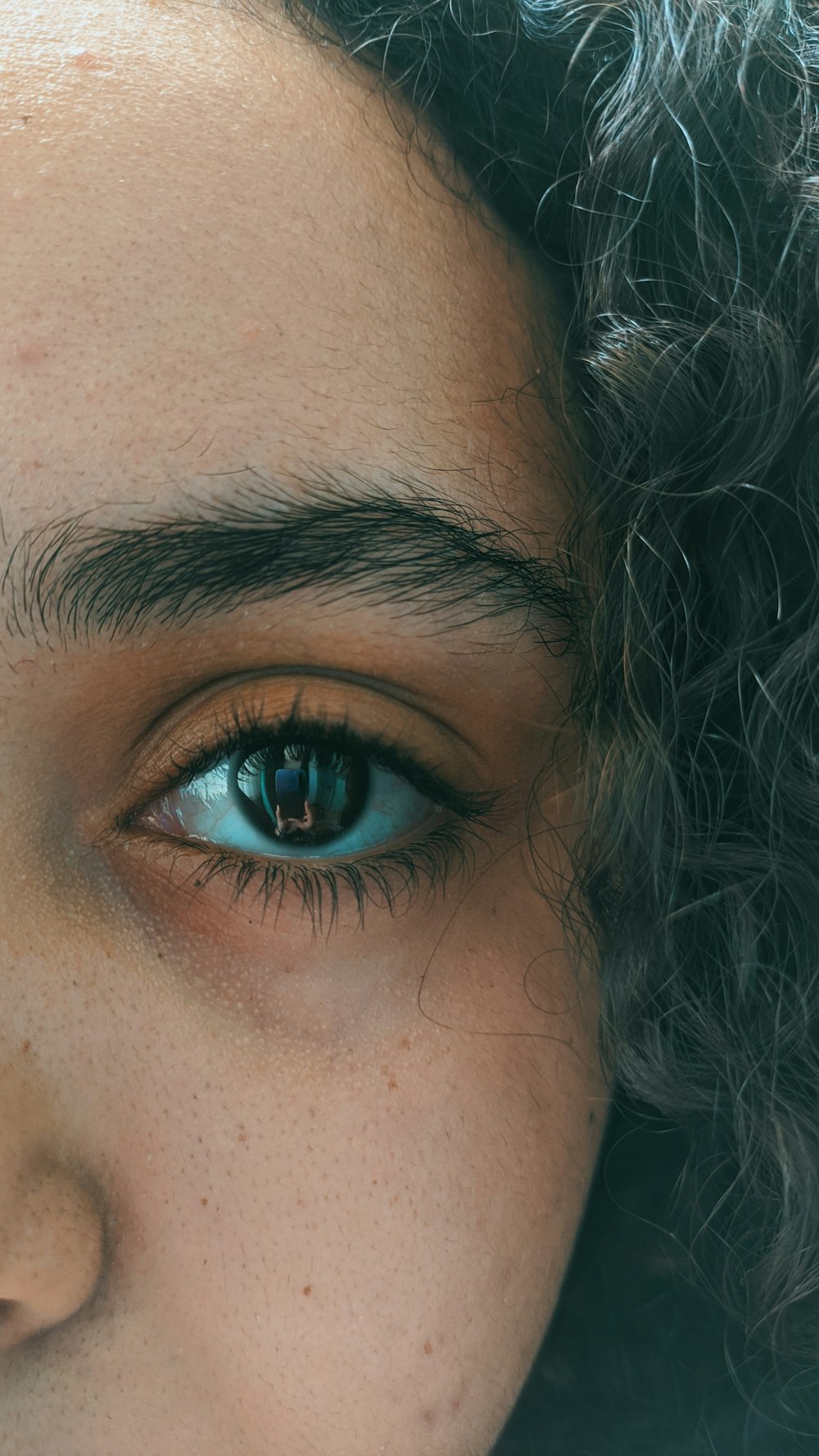 woman with black hair and blue eyes