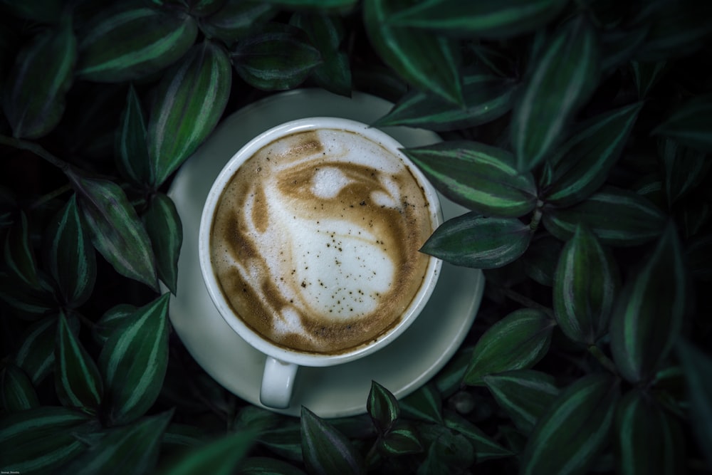 white ceramic mug with brown liquid inside