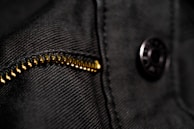 Close-up of an Oxford bag zipper and fabric texture under natural light.