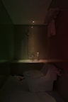 A clean bathroom with contemporary fixtures and soft lighting.