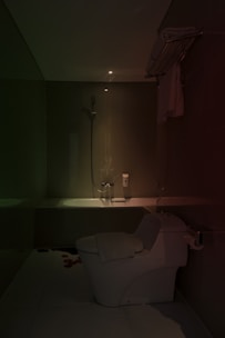 A beautifully remodeled bathroom featuring modern fixtures and warm lighting.