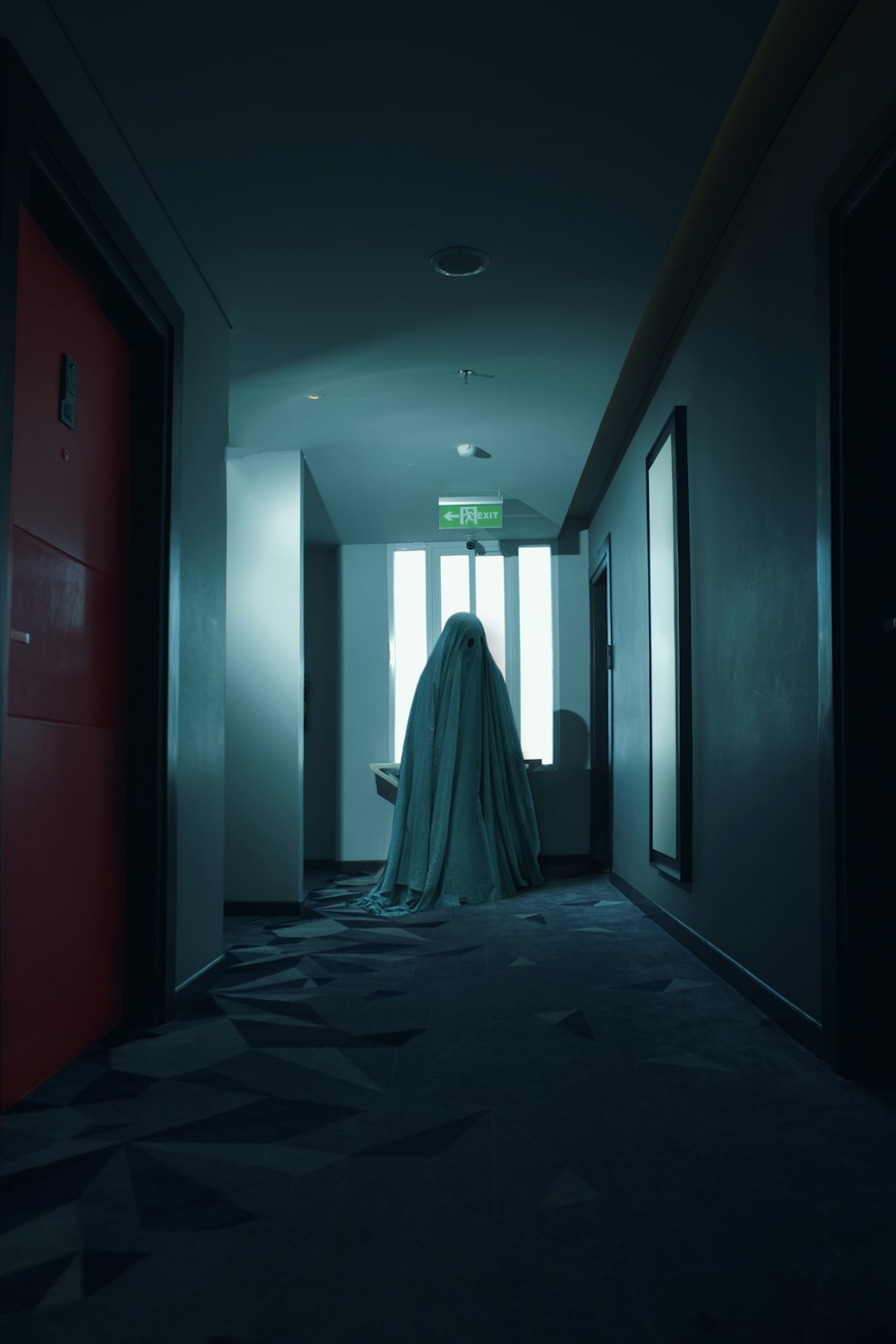 woman in white dress walking on hallway