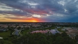 Sunset view of a peaceful suburban neighborhood with tree-lined streets.