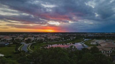 Sunset view of a peaceful suburban neighborhood with tree-lined streets.