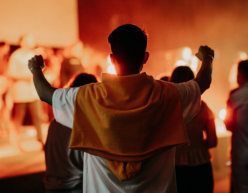 man in white shirt standing