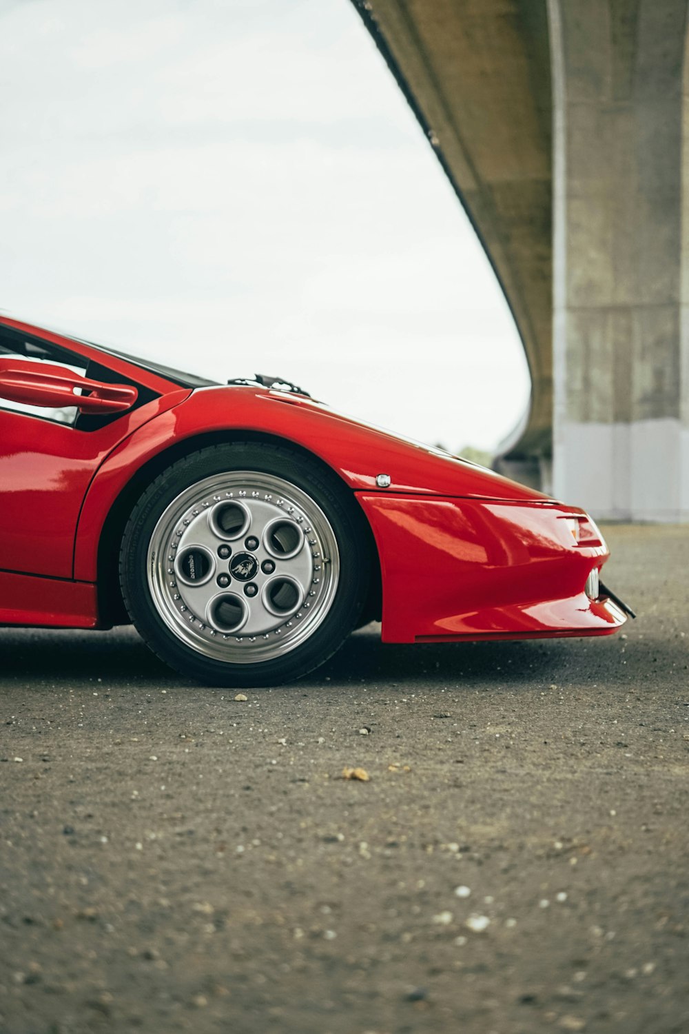 red ferrari 458 italia parked on gray asphalt road