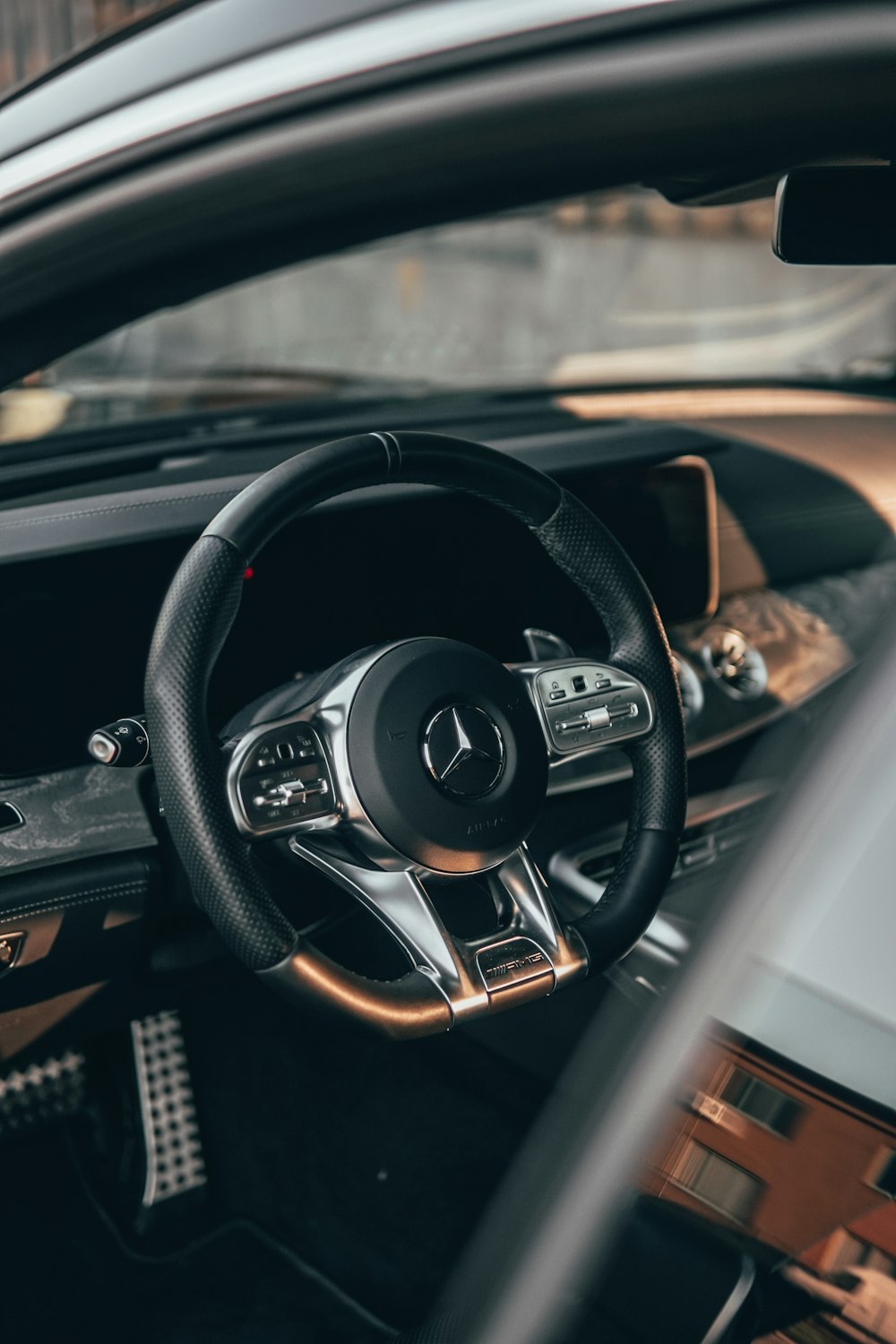 black and silver mercedes benz steering wheel