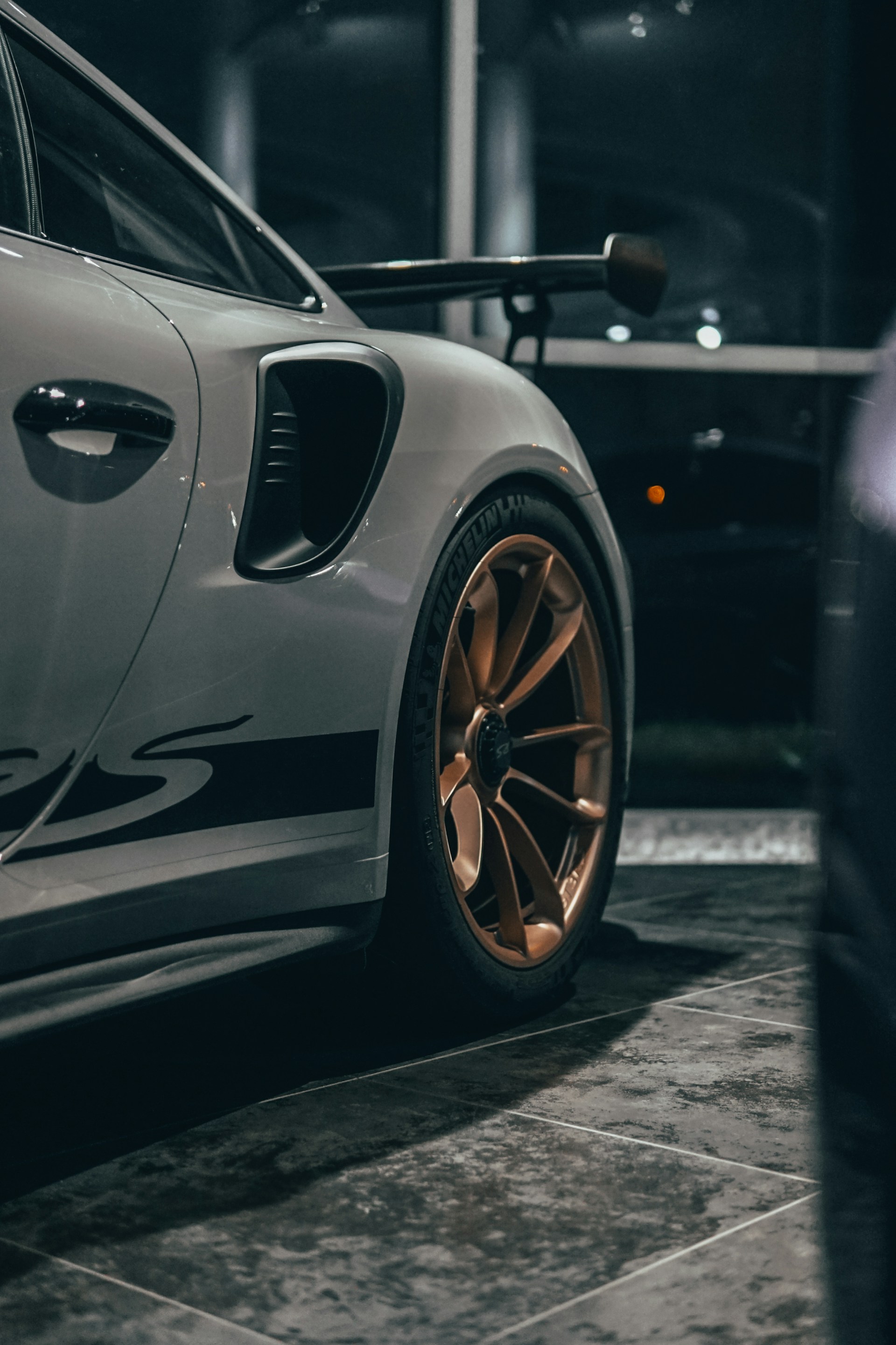 white porsche 911 parked on parking lot