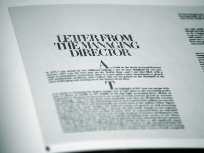 A printed page featuring a letter titled 'Letter from the Managing Director' with smaller text below. The page is angled slightly and appears to be from a formal publication, possibly a business report or brochure.