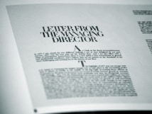 A printed page featuring a letter titled 'Letter from the Managing Director' with smaller text below. The page is angled slightly and appears to be from a formal publication, possibly a business report or brochure.