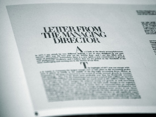 A printed page featuring a letter titled 'Letter from the Managing Director' with smaller text below. The page is angled slightly and appears to be from a formal publication, possibly a business report or brochure.