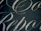 Elegant, cursive script in a light color is set against a dark background, creating a sophisticated and refined aesthetic.