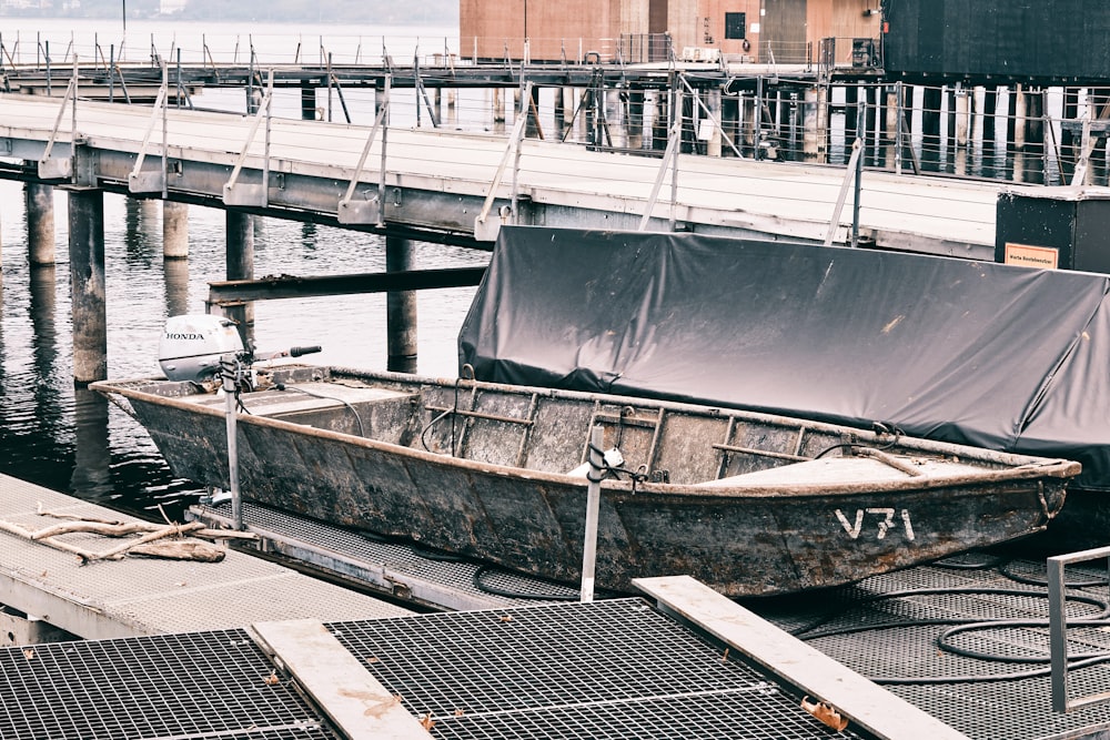 brown wooden boat on water during daytime