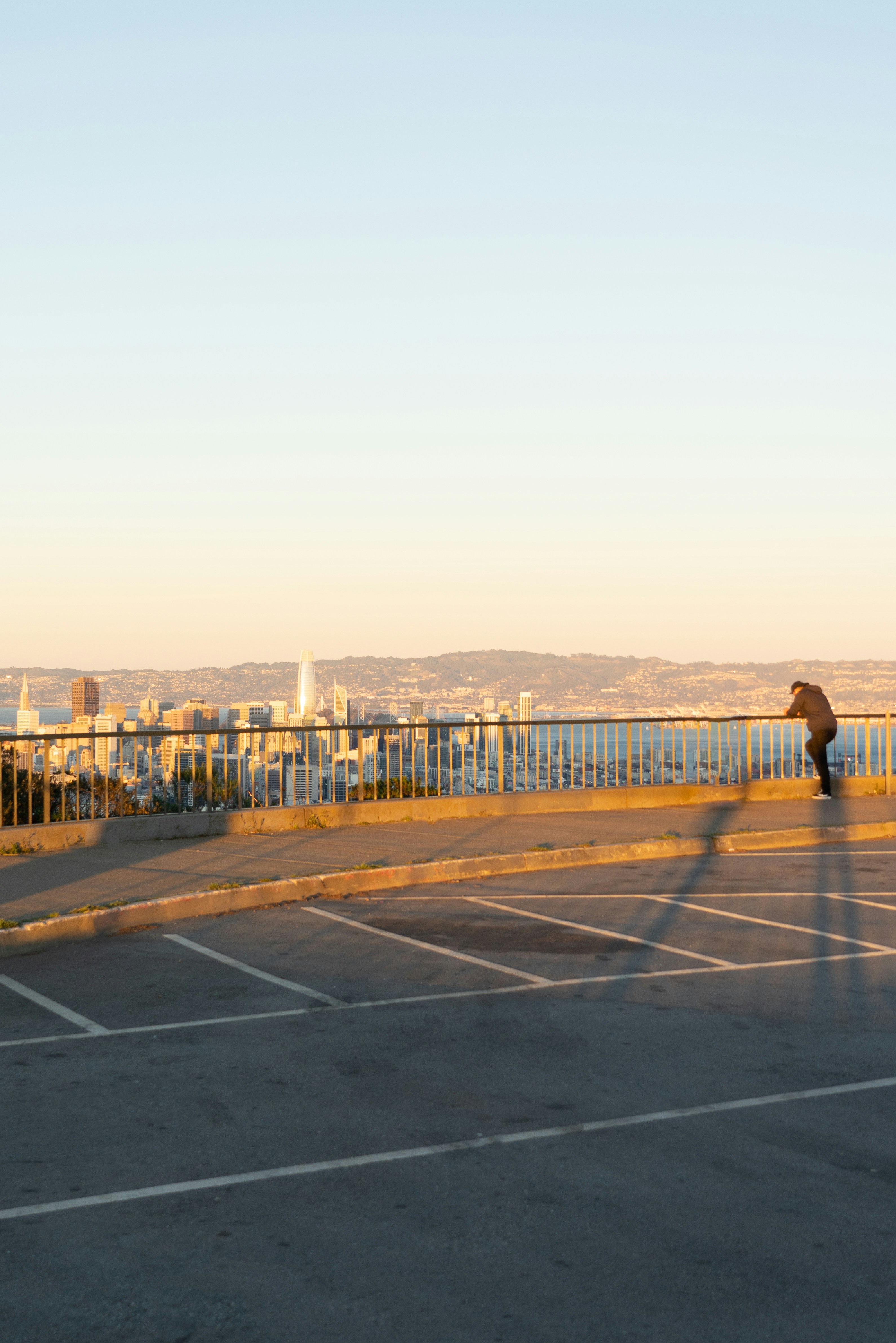 person walking on gray concrete road during daytime