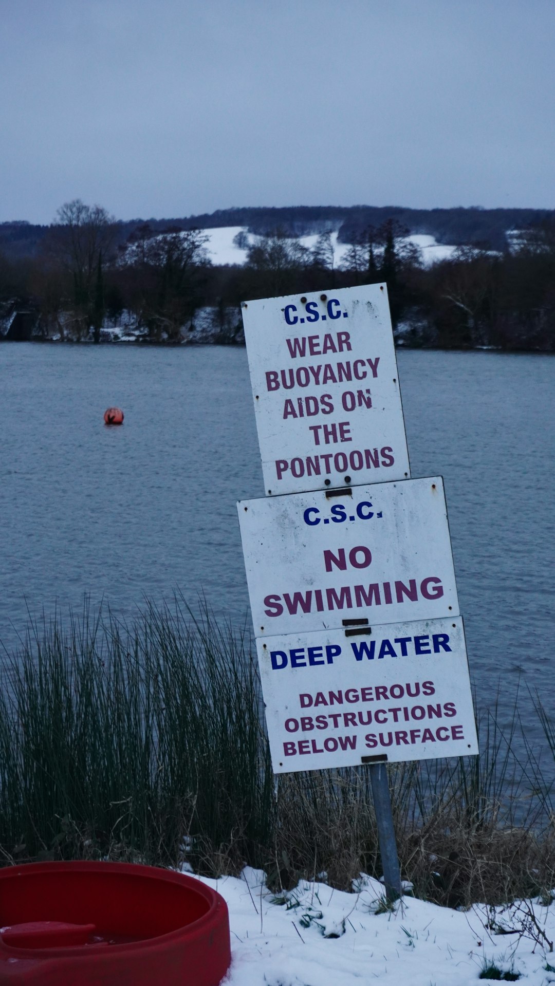 white and black quote board near body of water during daytime