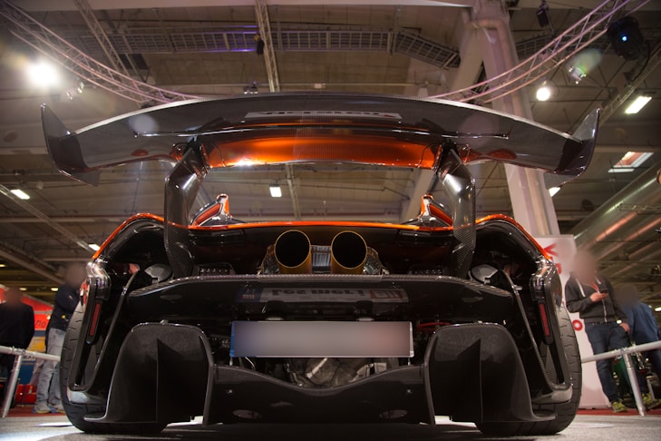 black and red car in a room