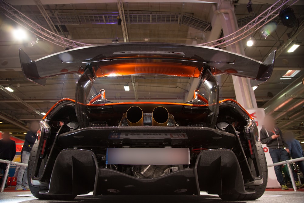 black and red car in a room