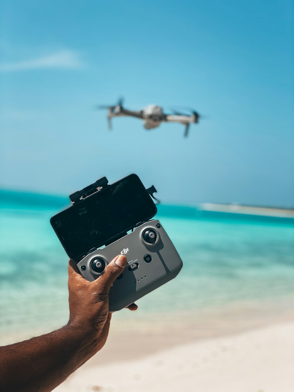 person holding black and silver camera