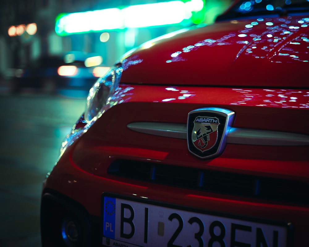 red ford mustang on road during night time