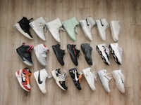 white black and red nike athletic shoes