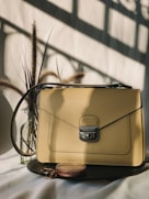 brown leather handbag on white table