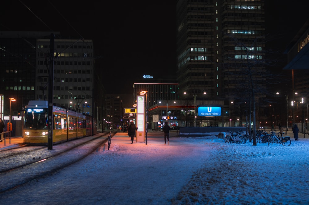 people walking on street during night time