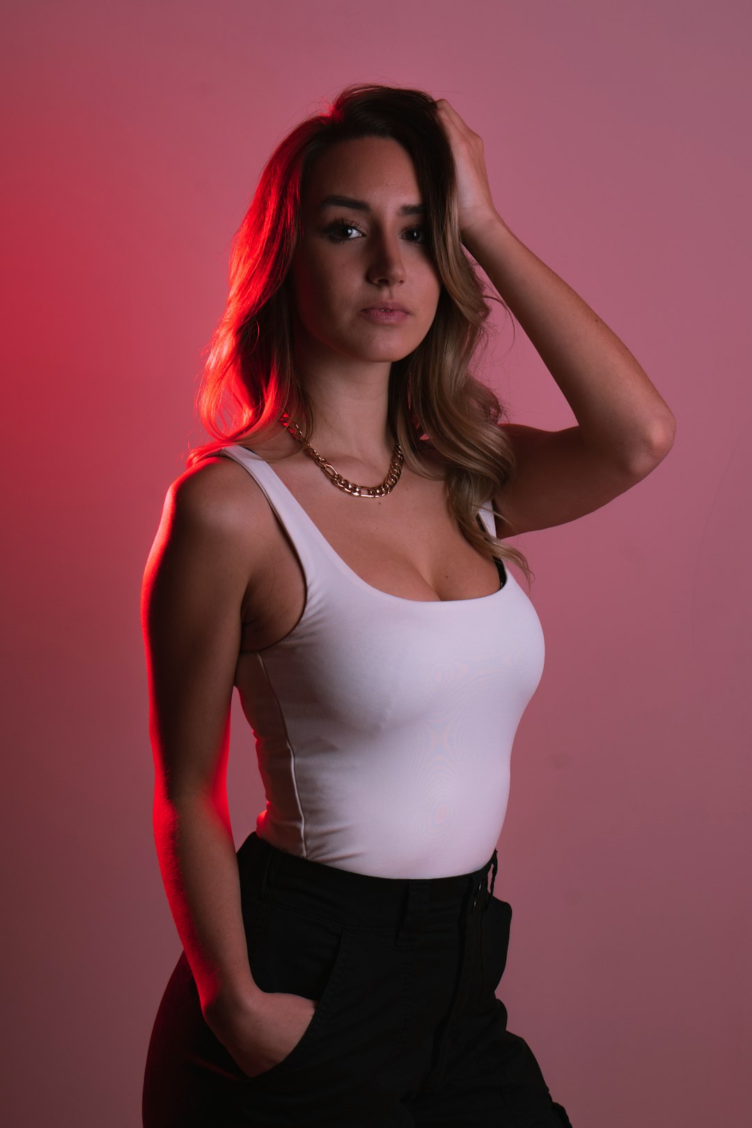 woman in white tank top and black pants