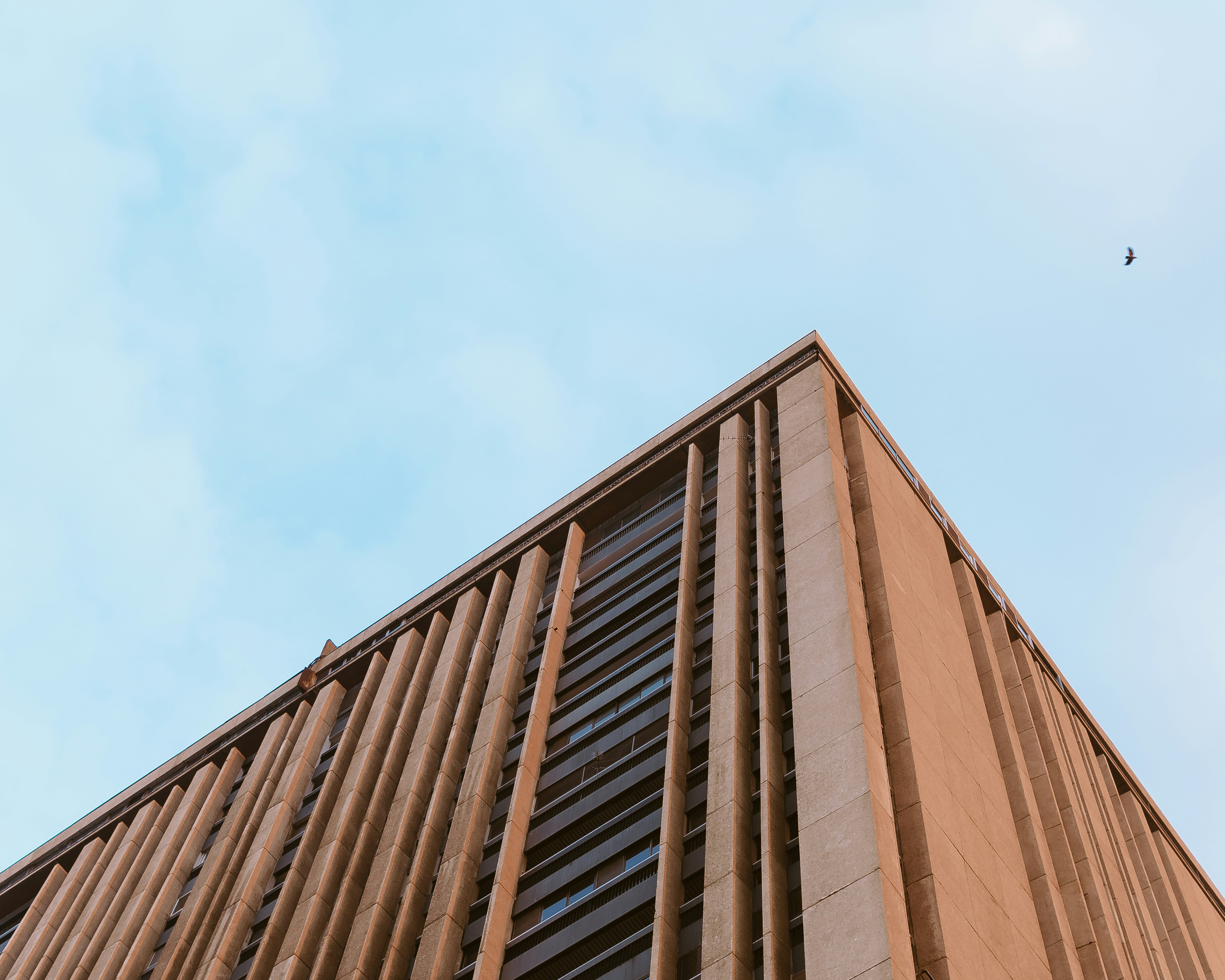 brown concrete building under blue sky during daytime