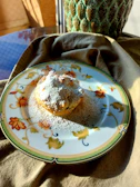 Handmade goiabada cascão slices arranged on a vintage ceramic plate on a linen cloth