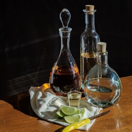 A beautiful bottle of cydonian's quince aperitif displayed on a rustic wooden table.