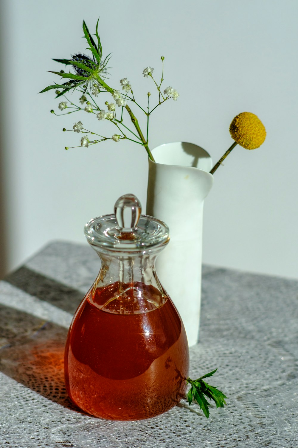 yellow flower in clear glass vase