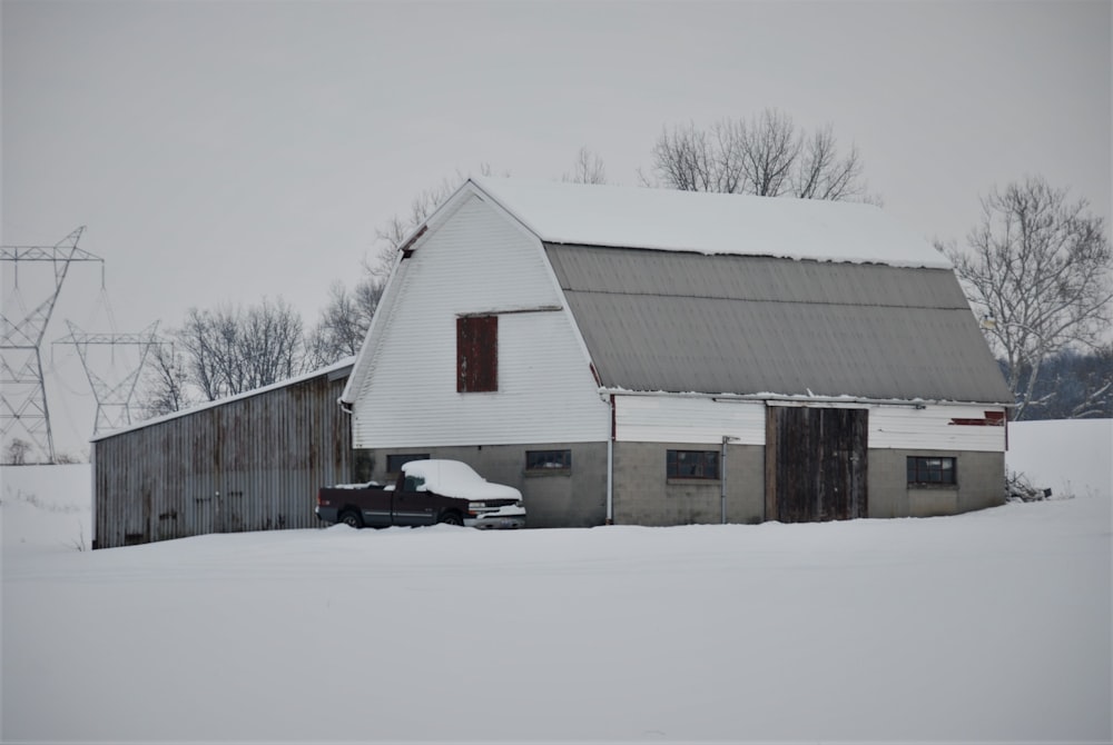 brown wooden house on snow covered ground