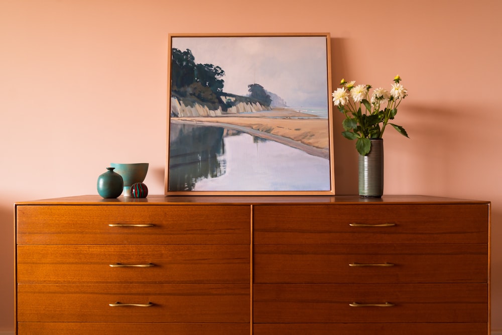 brown wooden drawer with painting