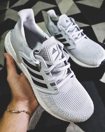 A close-up of lightweight running sneakers on a track, showcasing their breathable material and sleek design.