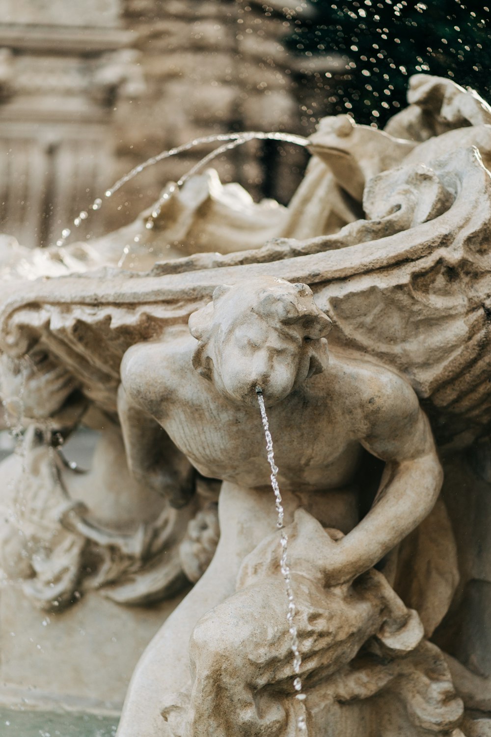 gray concrete statue fountain during daytime