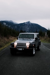 A roadside emergency kit laid out beside a vehicle on a quiet road.