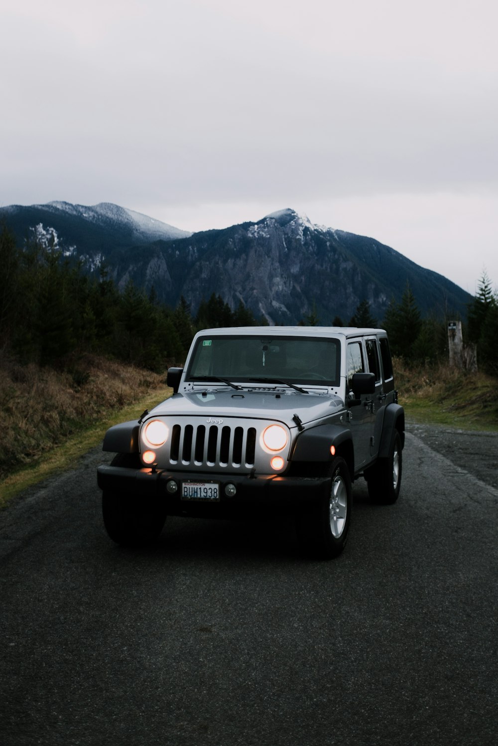 white jeep wrangler on road during daytime