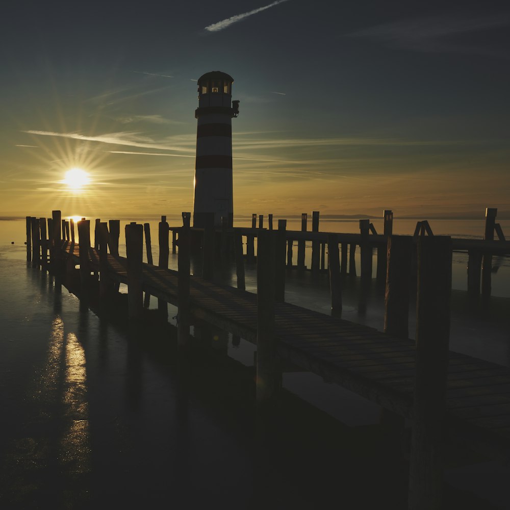 silhouette of dock during sunset