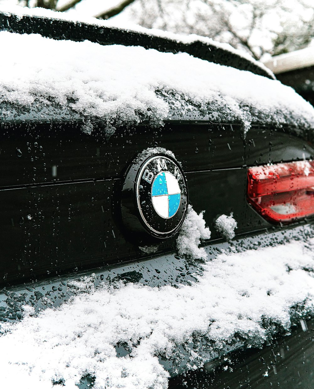 black car on snow covered ground