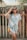woman in white and blue stripe button up shirt wearing black sunglasses