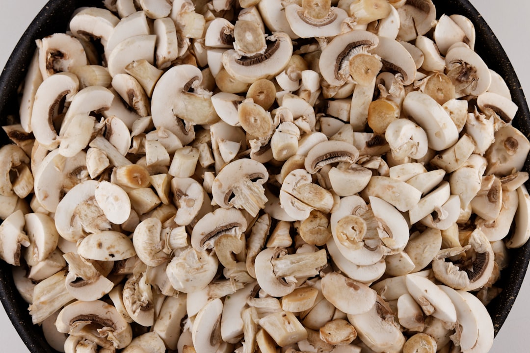 white and brown mushrooms on black background