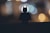 silhouette of person standing on the road during night time