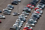 cars parked on parking lot during daytime
