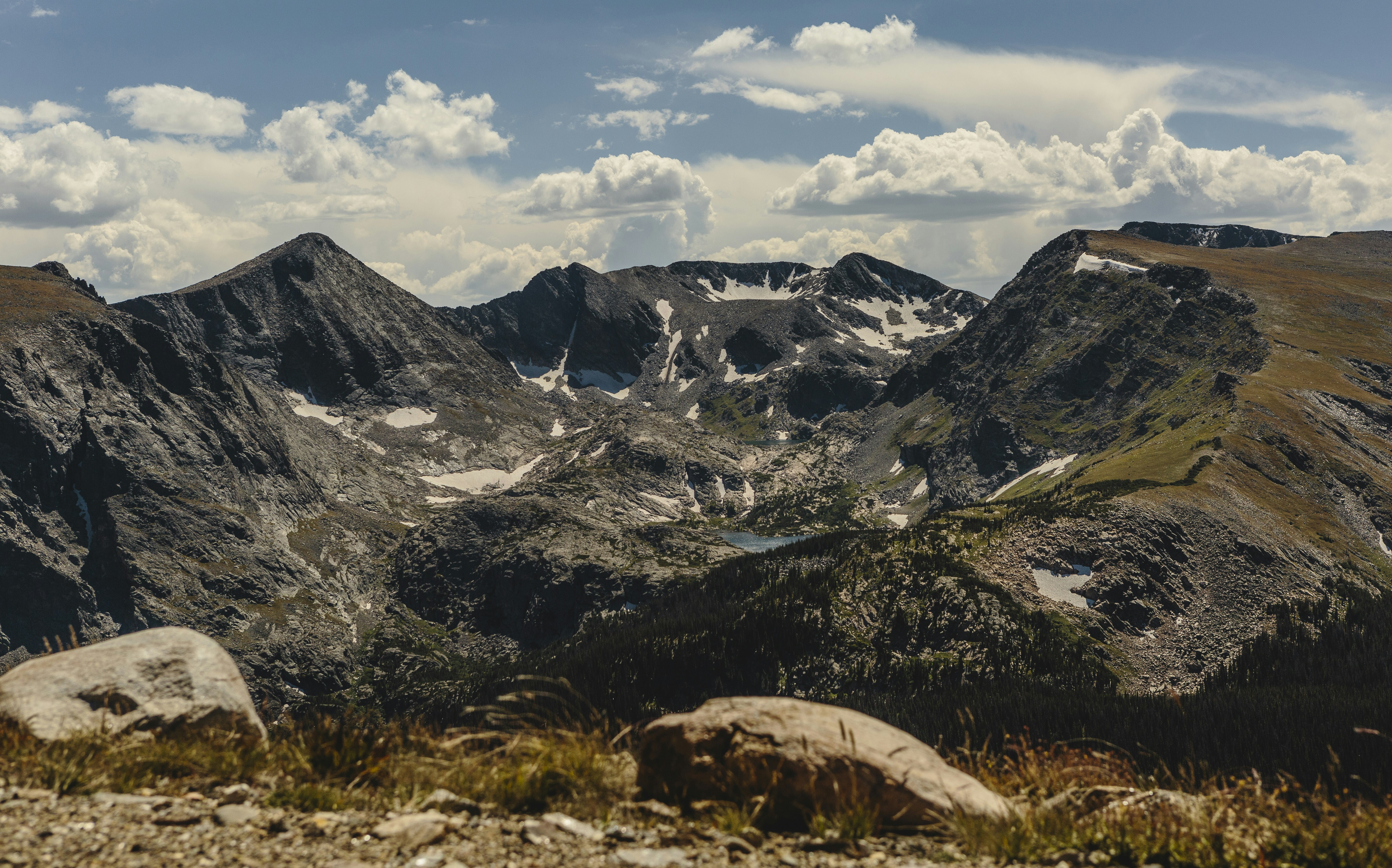 black and white mountains under white clouds and blue sky during daytime, 